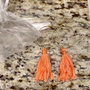Peach tassel earrings with a gold hoop